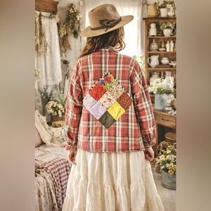 Upcycled patchwork artisan detailing on quilted jacket w southwestern vibe